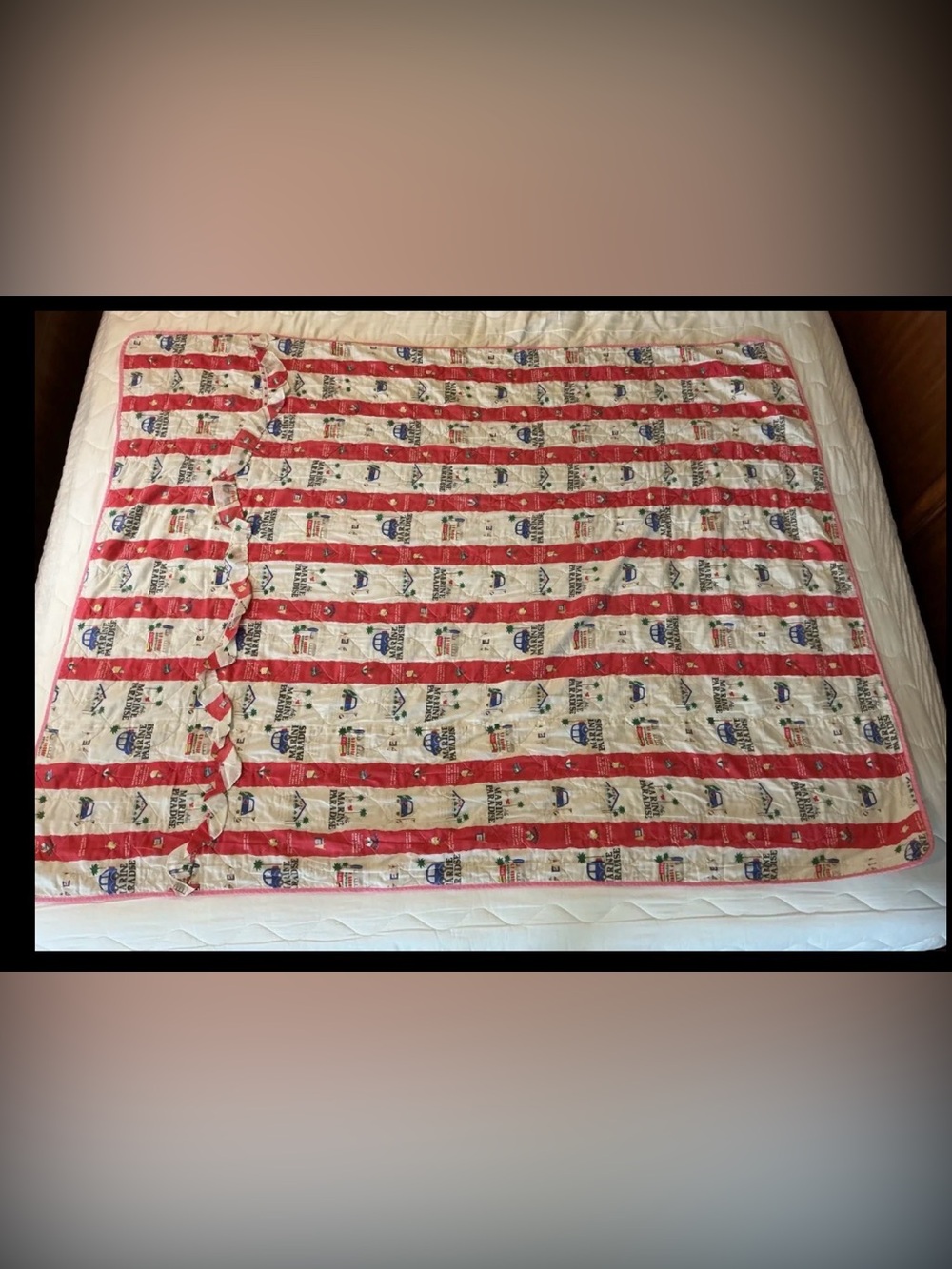 Vintage Marine Paradise quilted blanket featuring a colorful red and cream novel